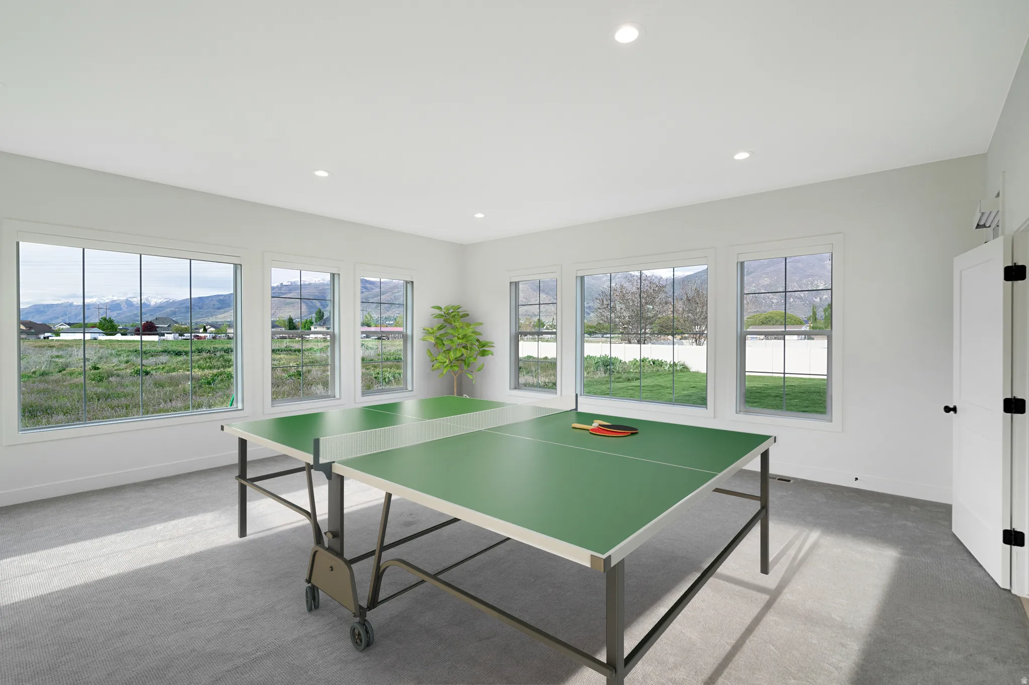 Game room with a mountain view, carpet, plenty of natural light, and recessed lighting