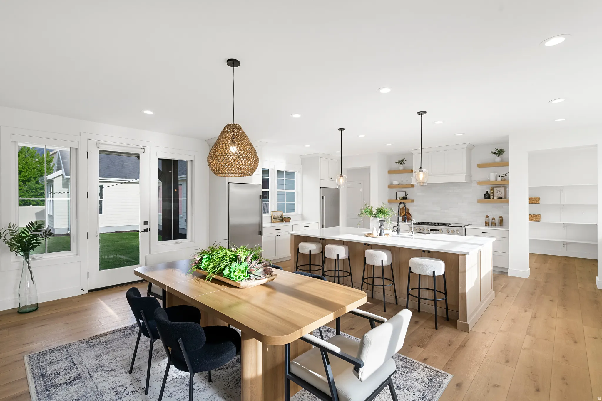 Dining room featuring light wood finished floors and recessed lighting