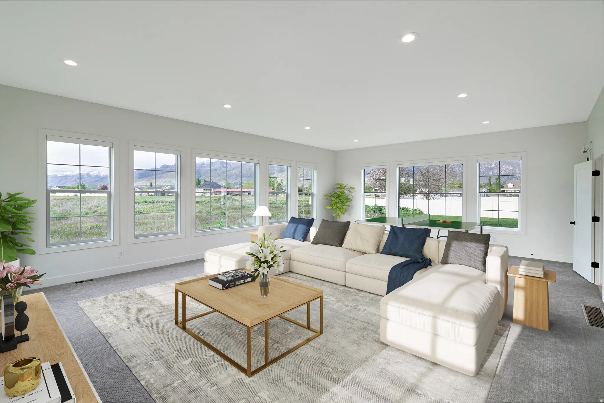 Living room featuring a mountain view and recessed lighting
