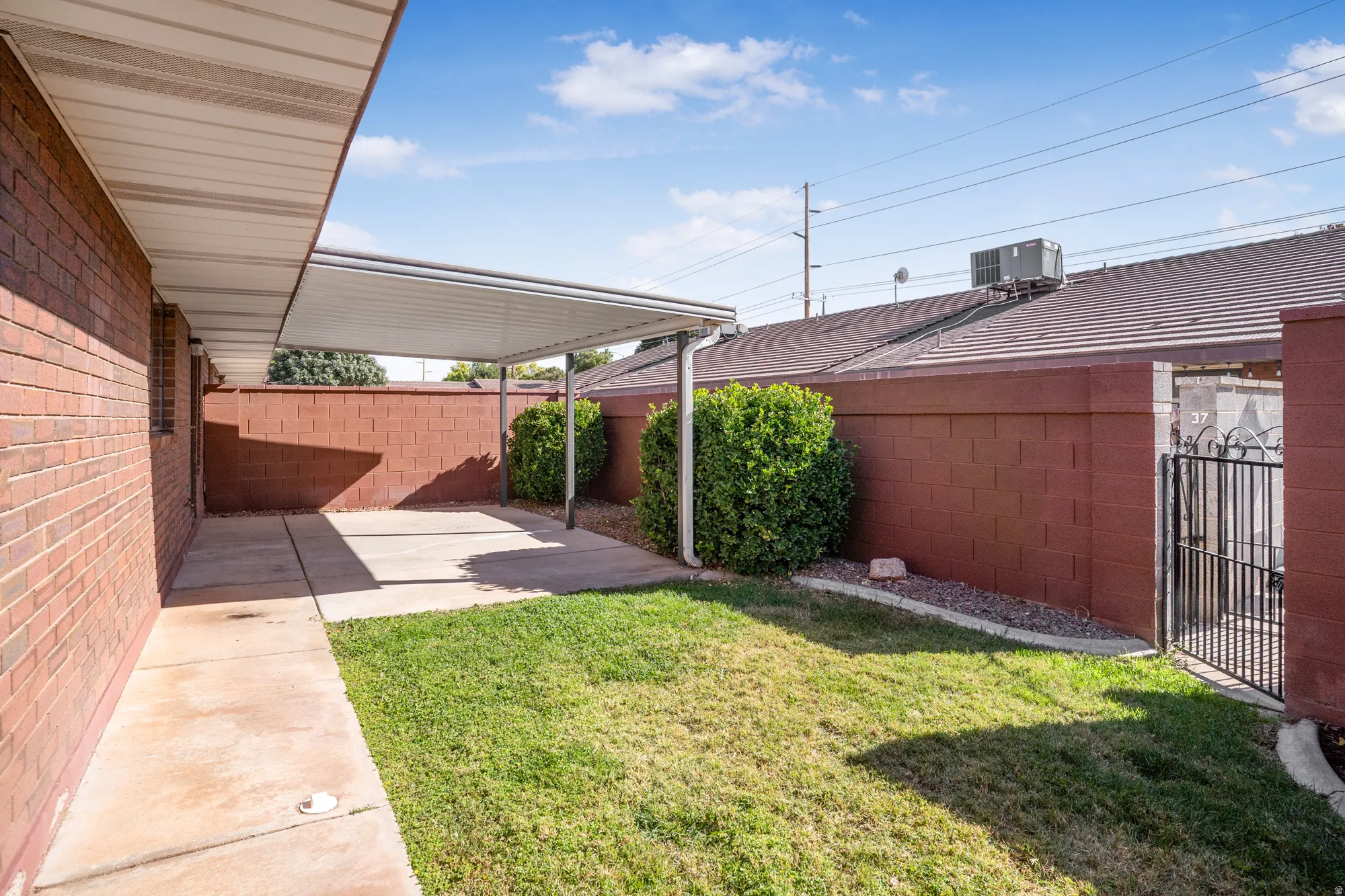 Fenced backyard with a patio area
