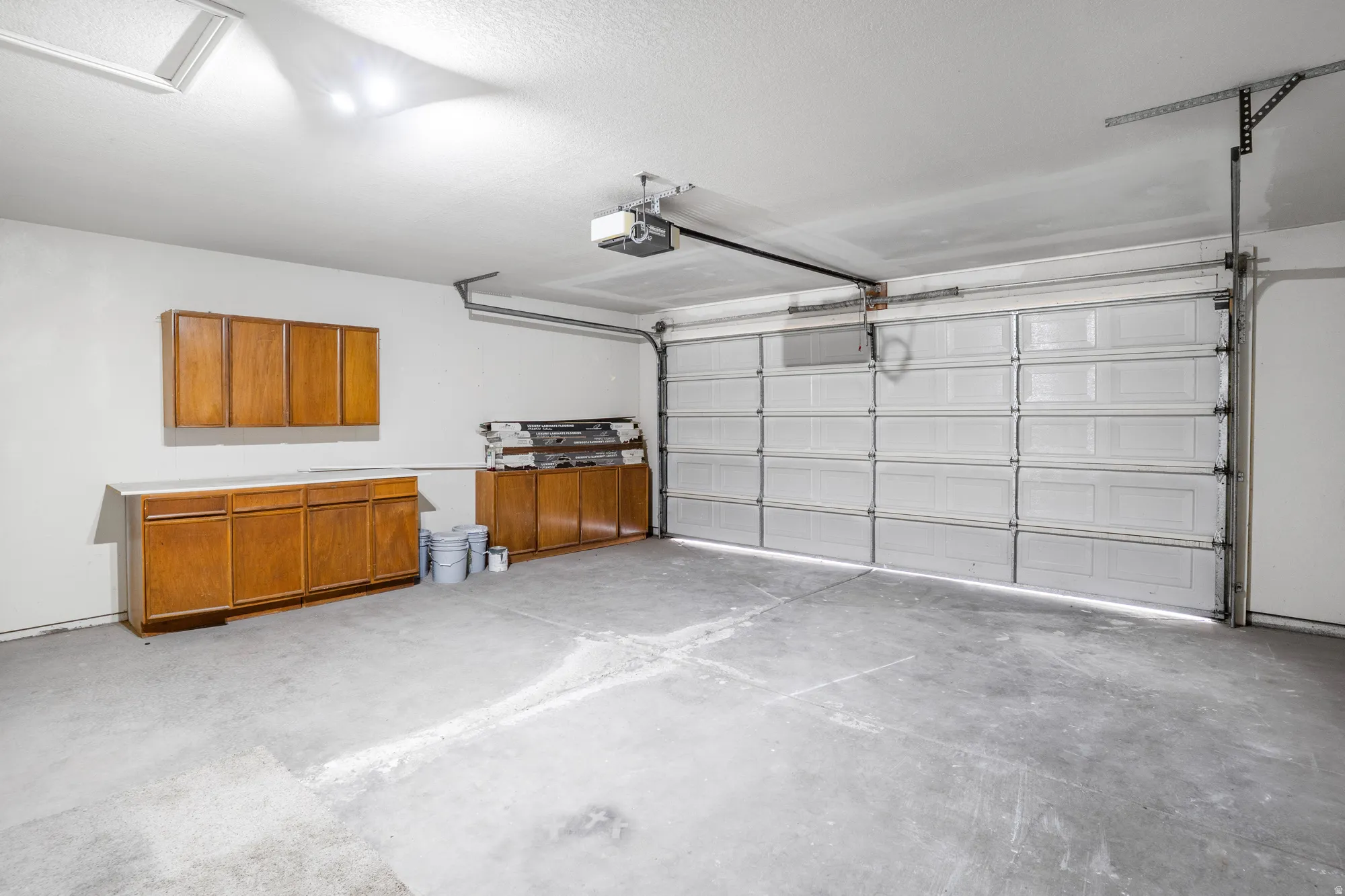 Garage featuring a garage door opener