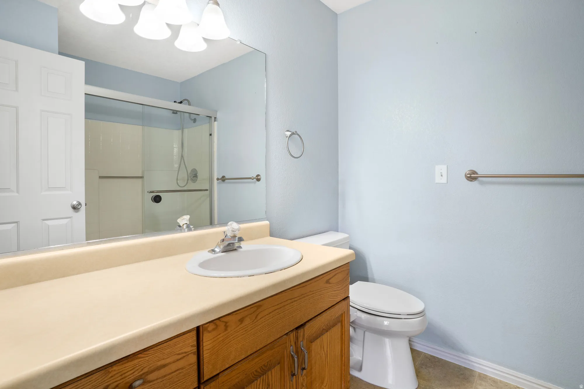 Bathroom with vanity and a shower stall