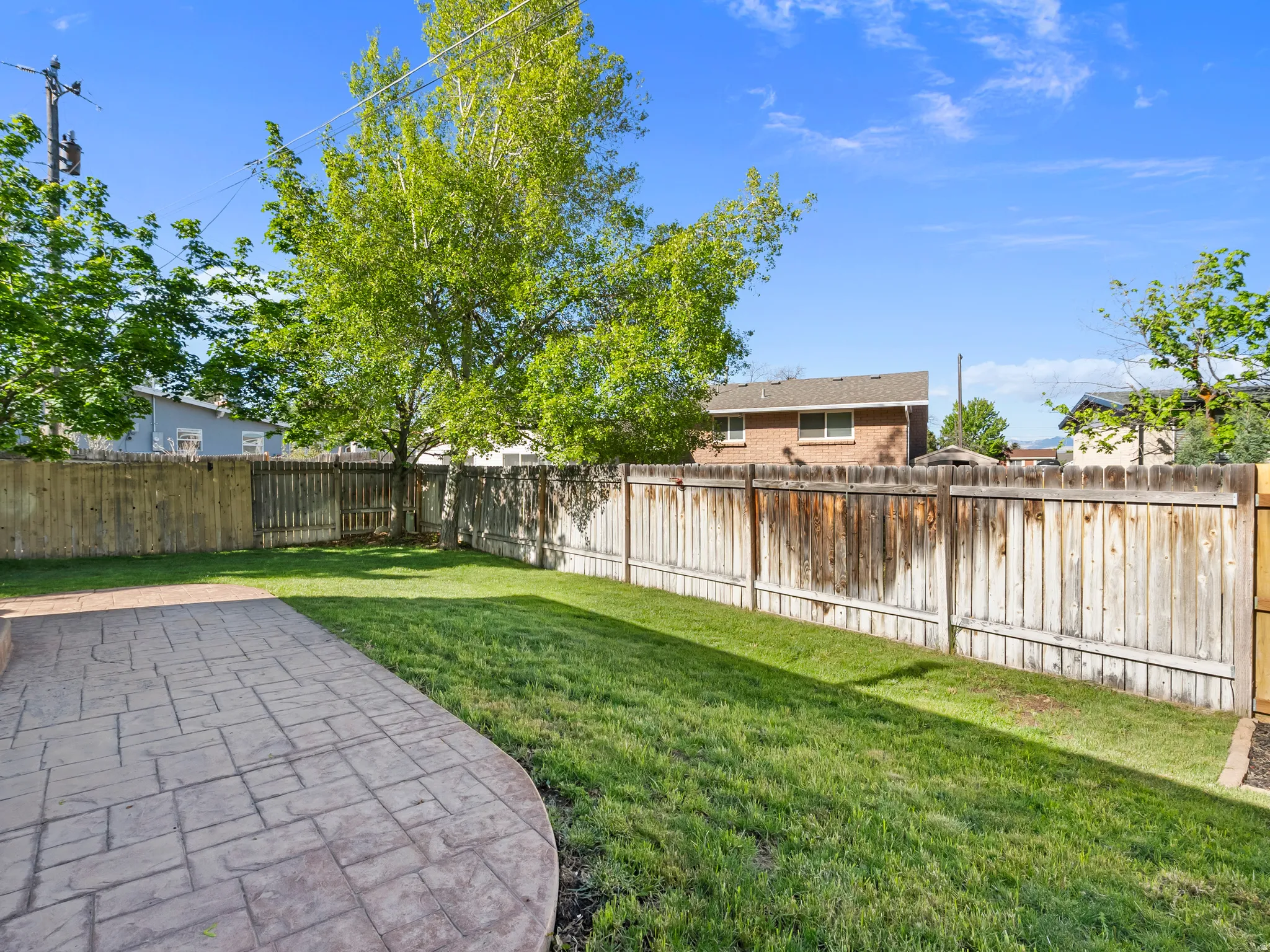 View of fenced backyard