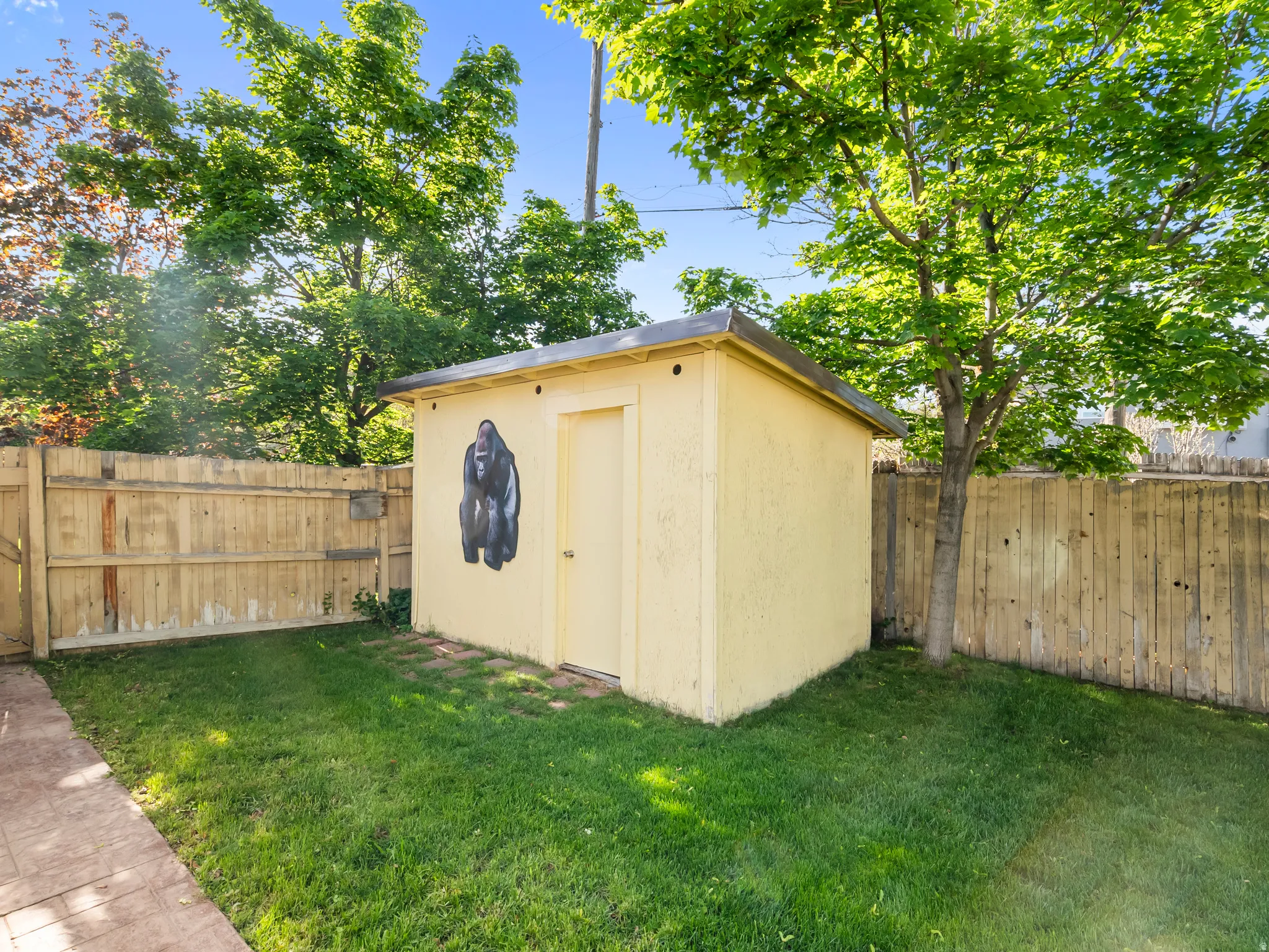 View of shed with a fenced backyard