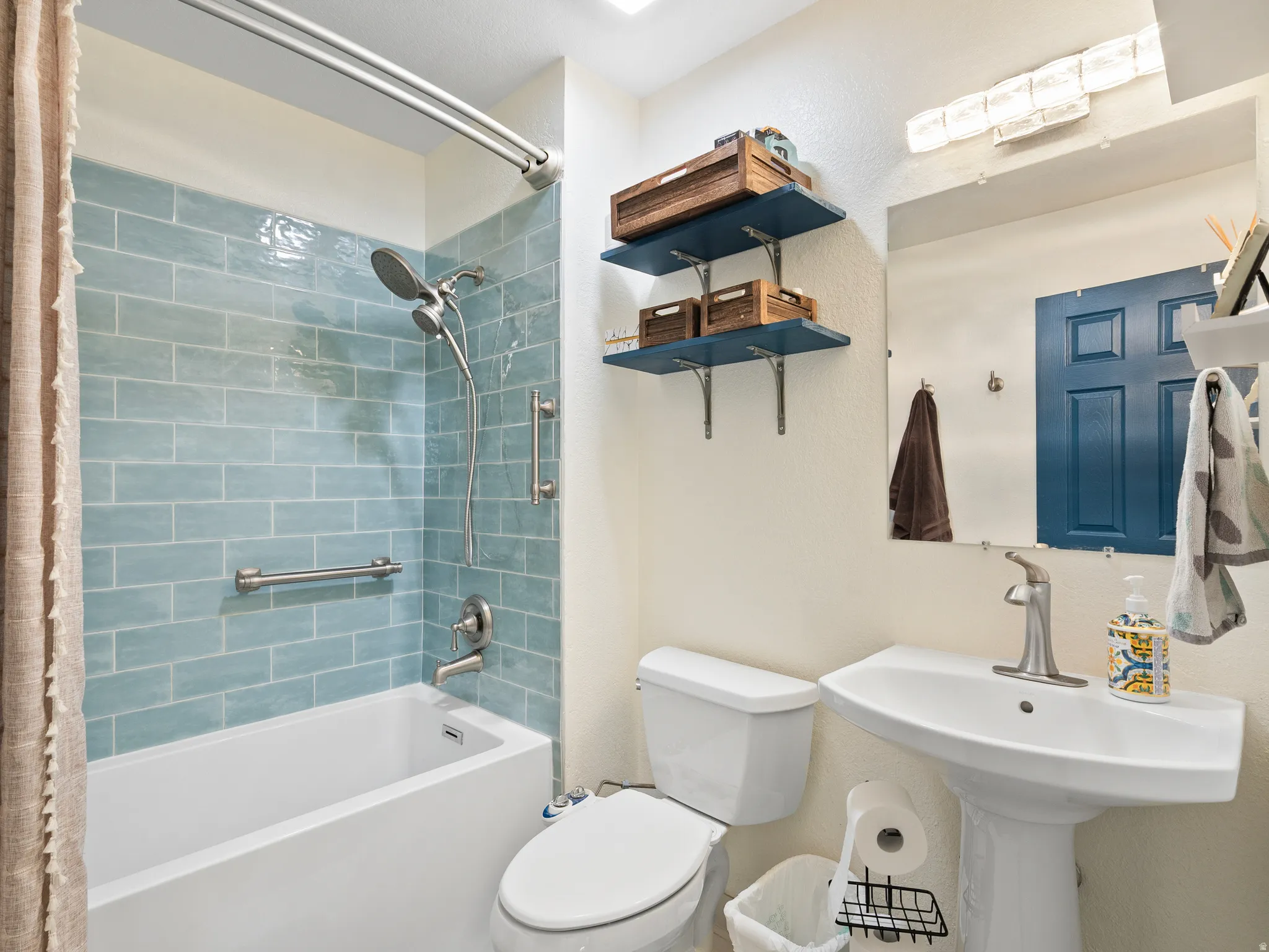 Bathroom with toilet and shower / bath combo