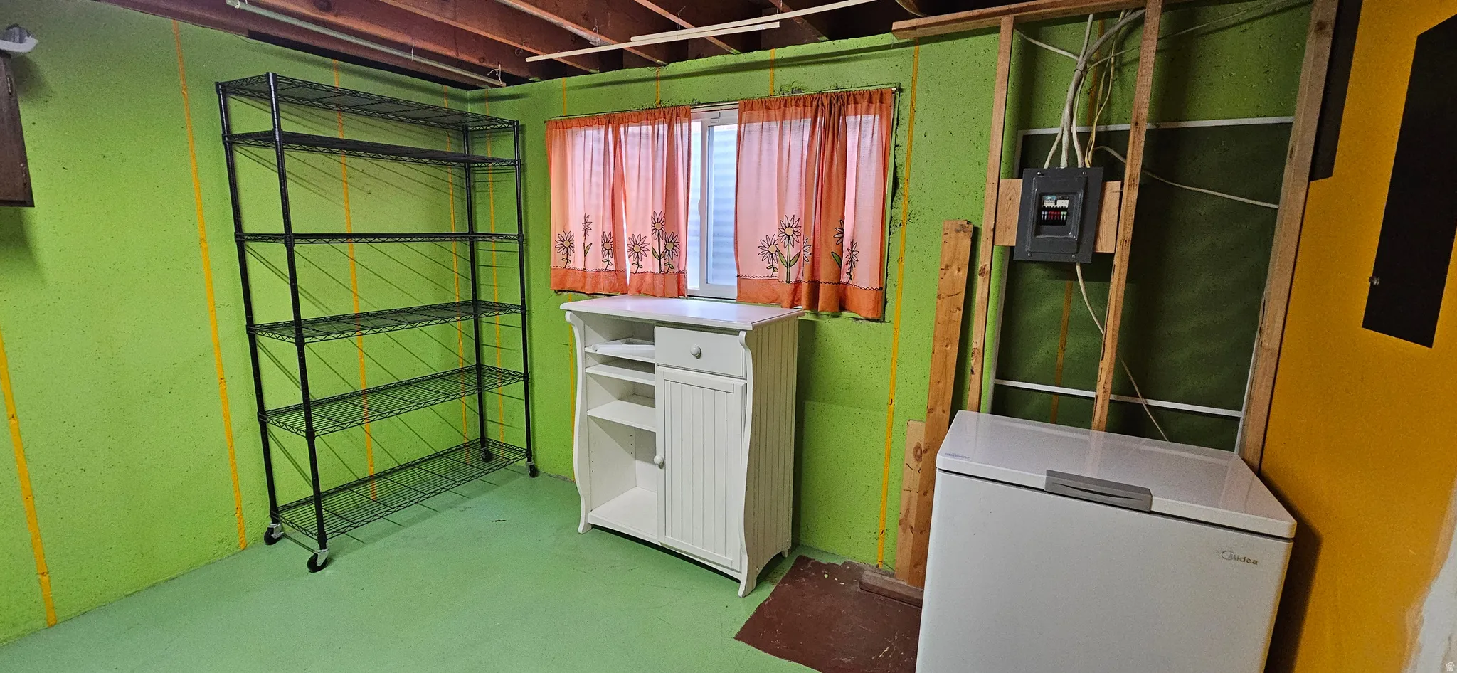 Laundry area featuring concrete floors