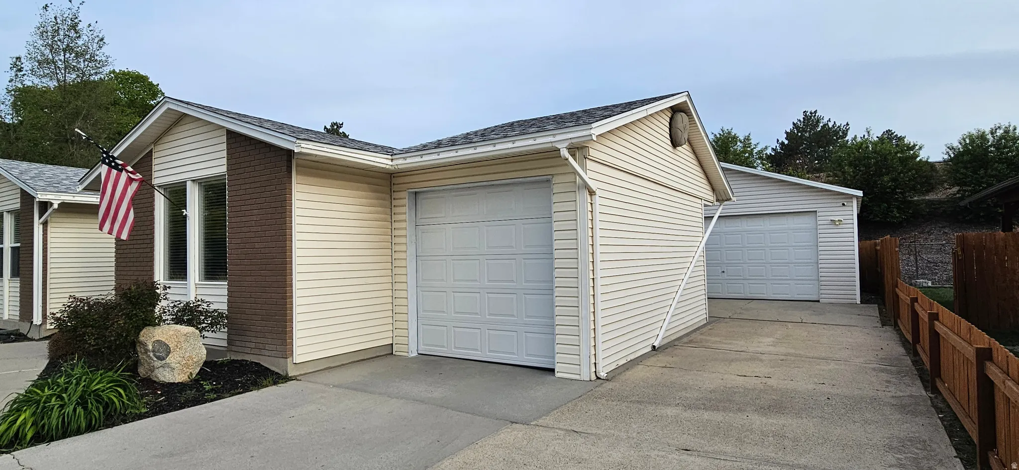 Garage with concrete driveway