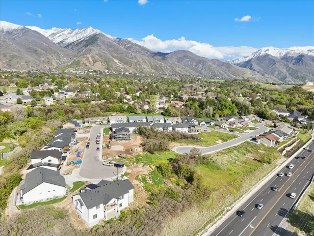 Aerial view of residential area featuring a mountainous background