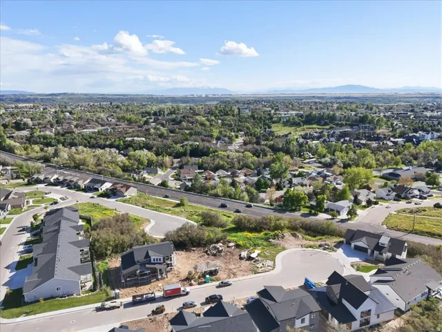 Aerial perspective of suburban area with a mountain backdrop