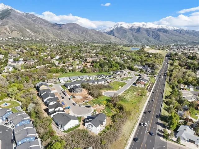 Aerial perspective of suburban area featuring a mountainous background