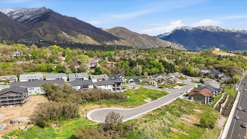 Aerial perspective of suburban area with a mountainous background