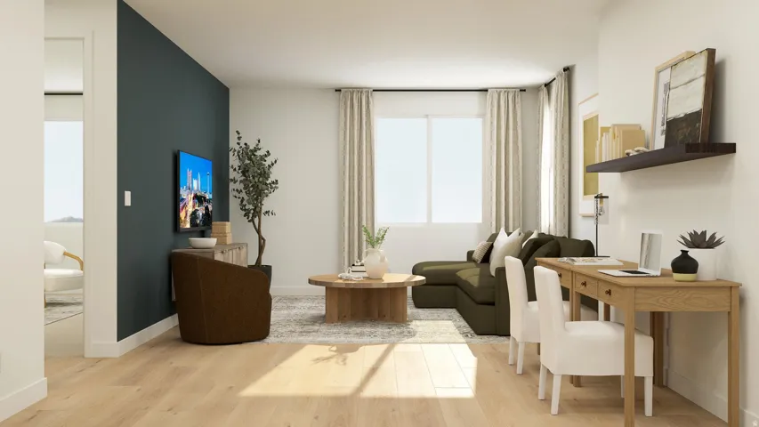 Sitting room featuring light wood-style floors and baseboards