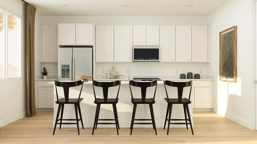 Kitchen featuring light countertops, white cabinets, light wood-type flooring, a center island, and stainless steel fridge