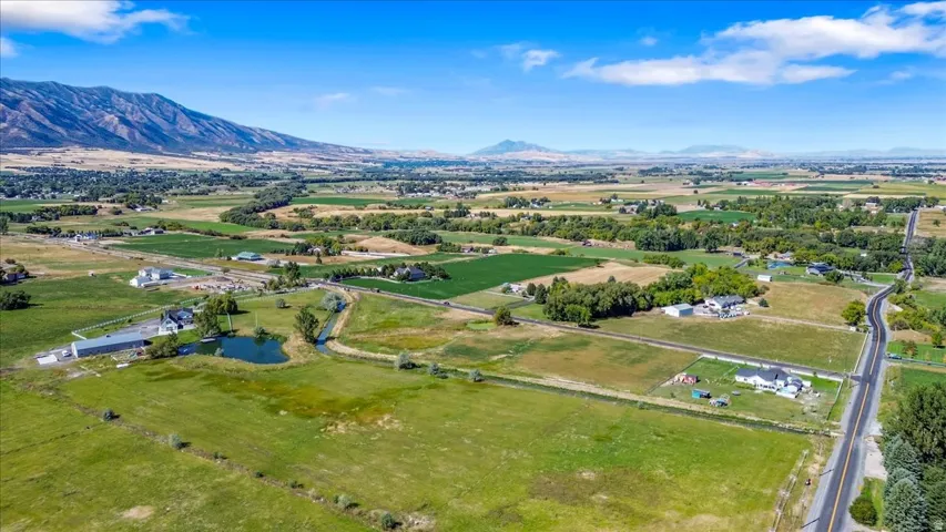 Aerial view of sparsely populated area with a water and mountain view