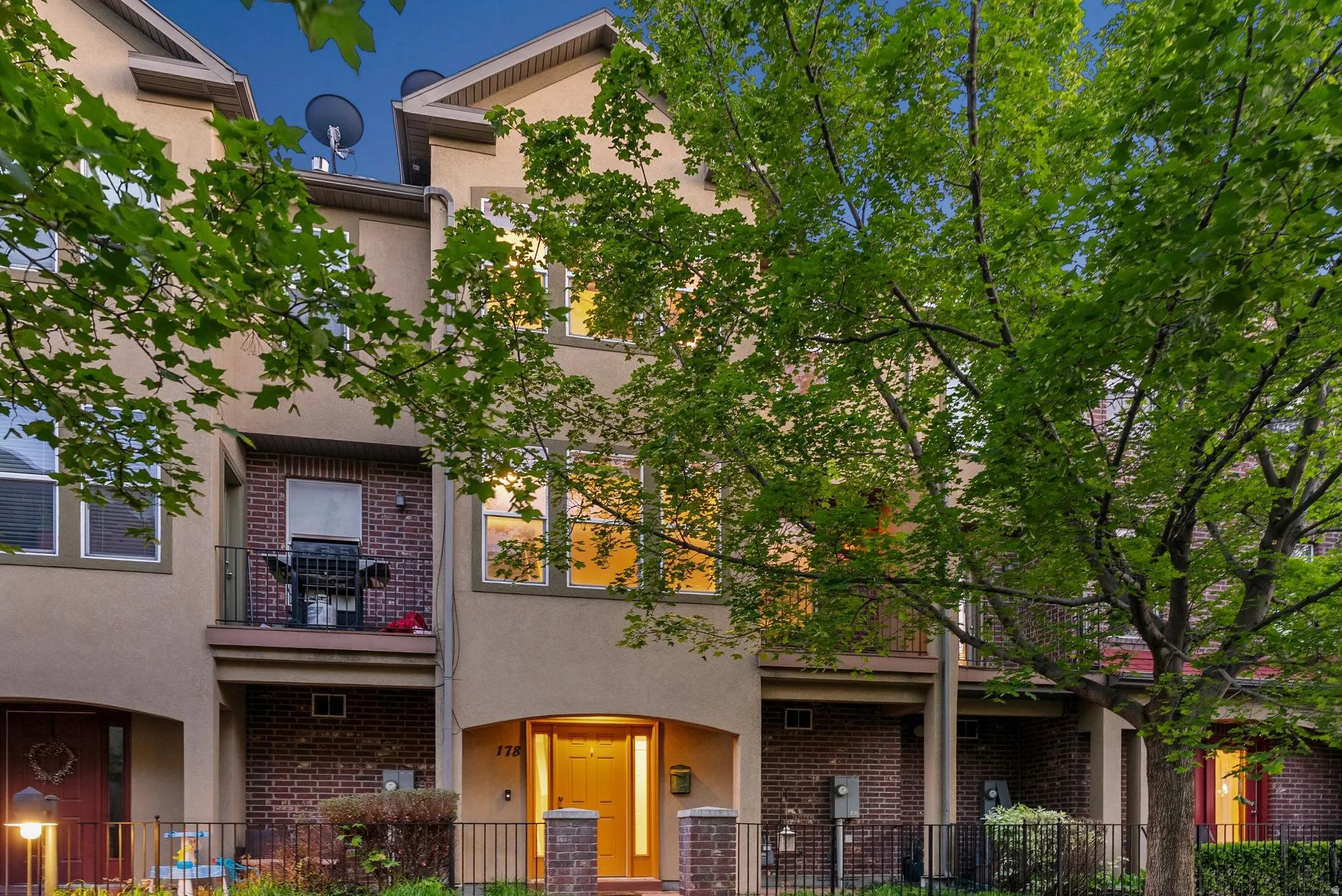 Traditional home with brick siding and stucco siding