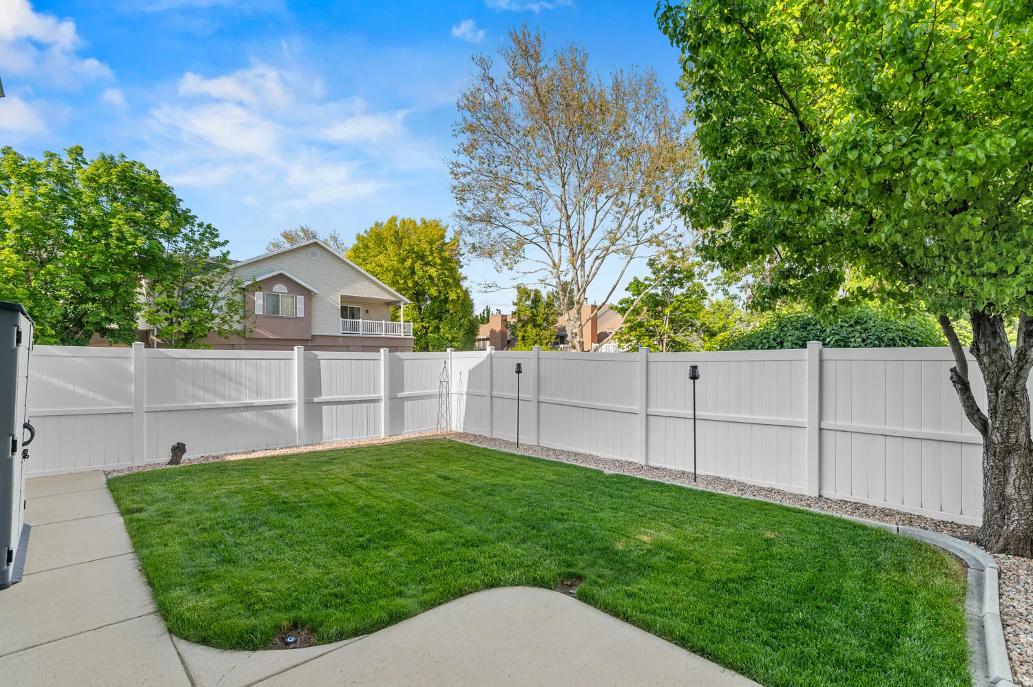 View of fenced backyard
