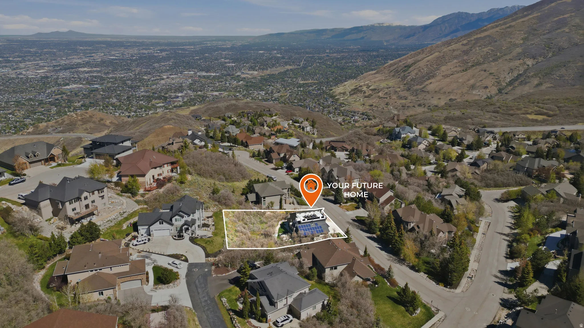 Aerial perspective of suburban area with mountains