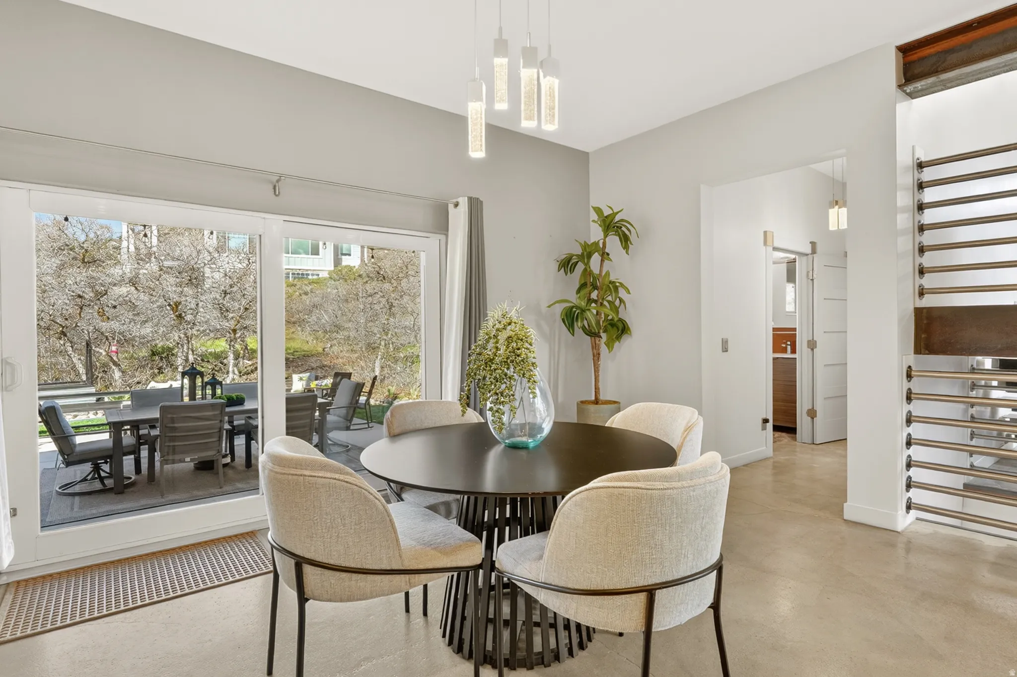 Dining room featuring concrete flooring and baseboards