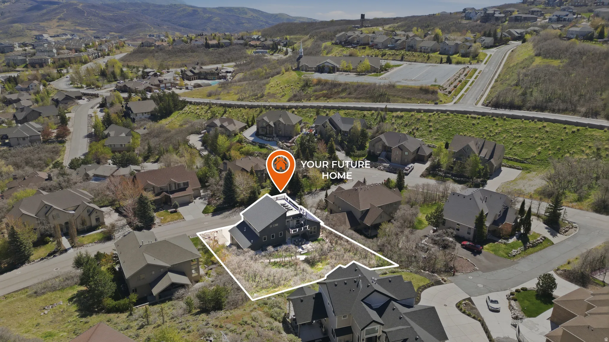 Aerial overview of property's location with nearby suburban area, property boundaries highlighted, and mountains