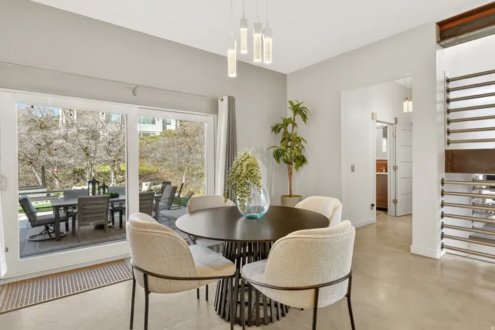 Dining room featuring concrete flooring and baseboards
