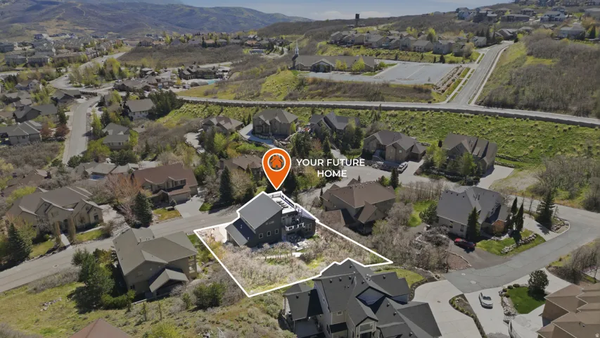 Aerial overview of property's location with nearby suburban area, property boundaries highlighted, and mountains