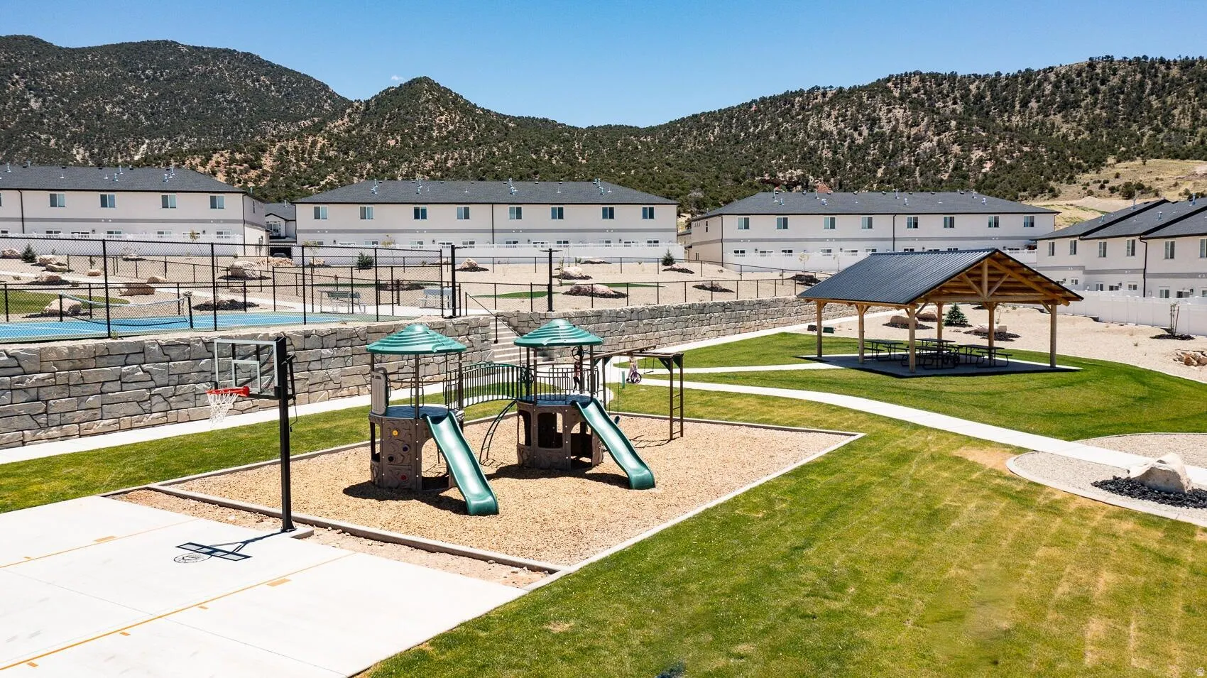 Community jungle gym with a residential view and a mountain view