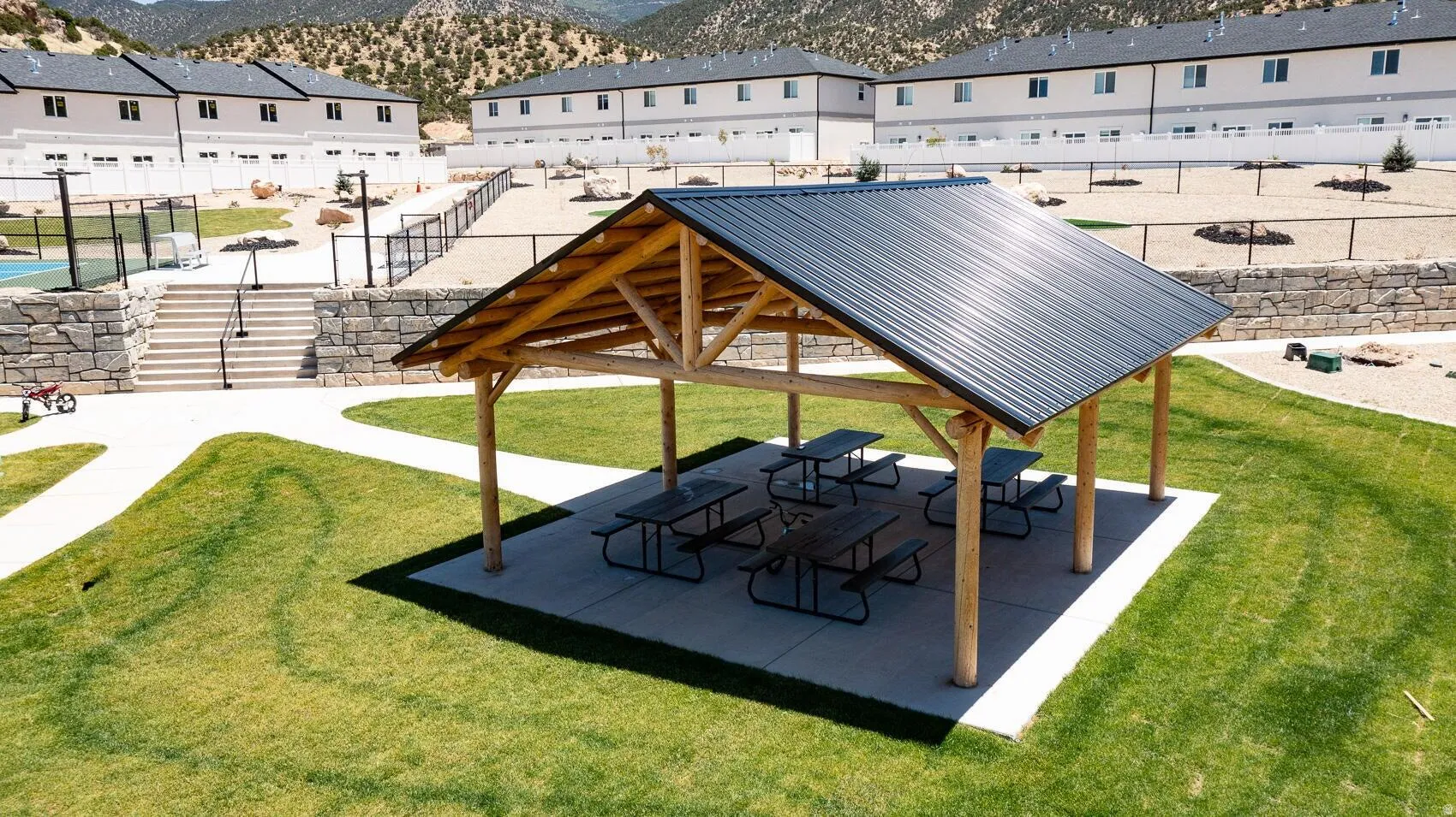 View of property's community featuring a patio and a mountain view