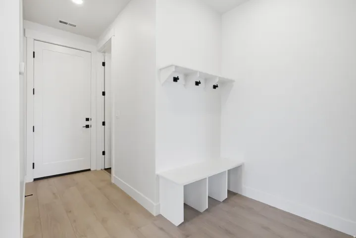 Mudroom with light wood finished floors