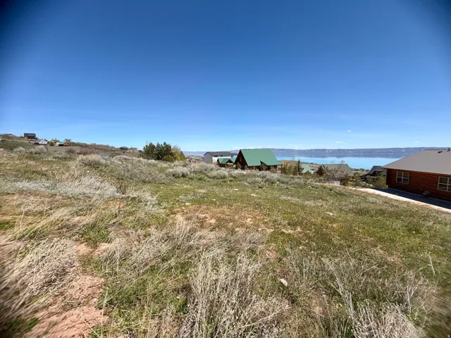View of yard with a water view