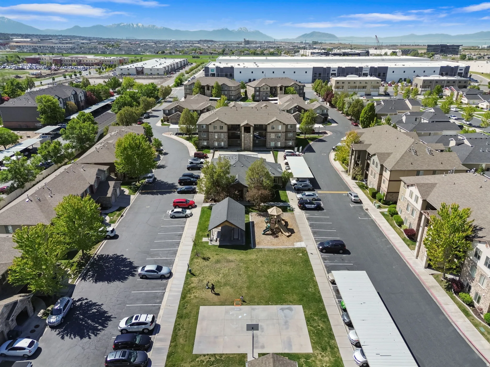 Aerial view of residential area featuring a mountainous background