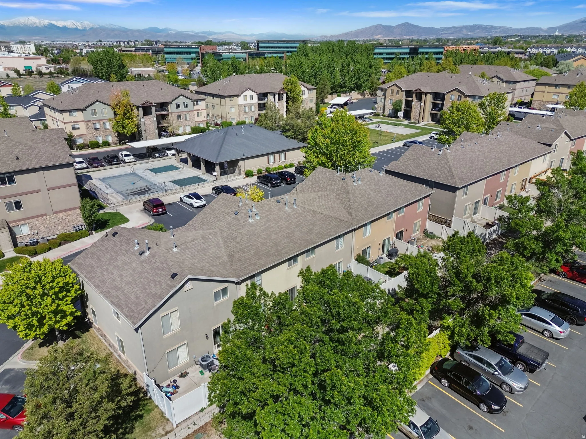 Aerial perspective of suburban area featuring a mountain backdrop