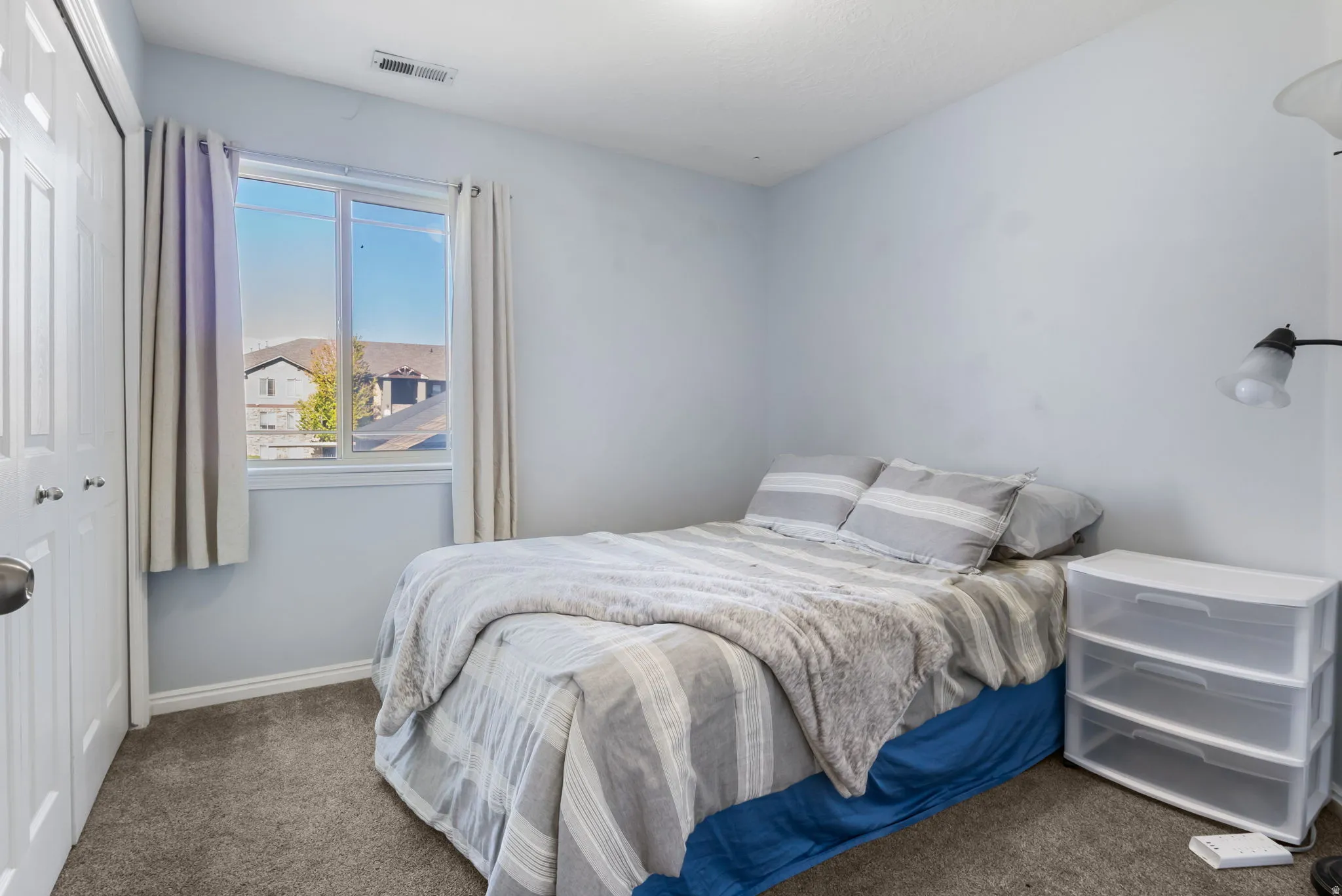Bedroom featuring a closet and carpet flooring