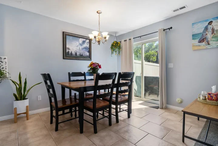 Dining space featuring a chandelier and light tile patterned floors