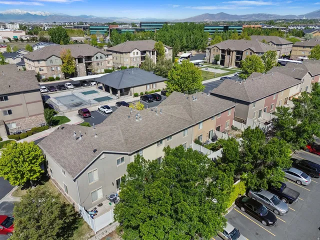 Aerial perspective of suburban area featuring a mountain backdrop
