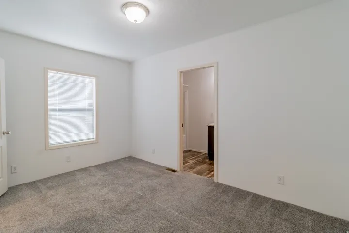 Unfurnished room with carpet