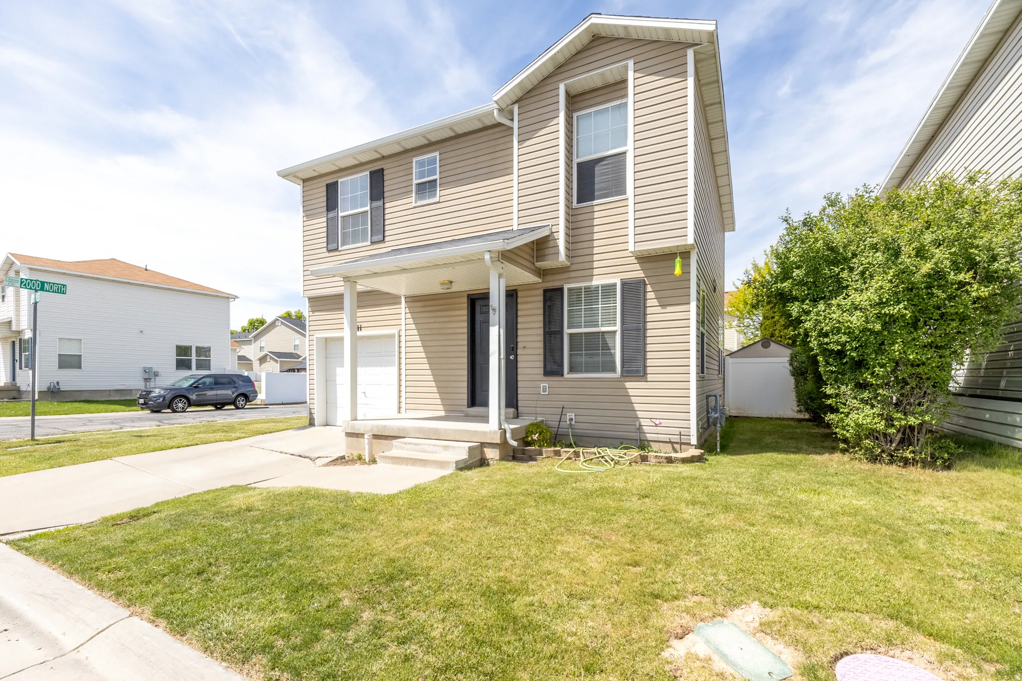 Traditional home with an attached garage and concrete driveway