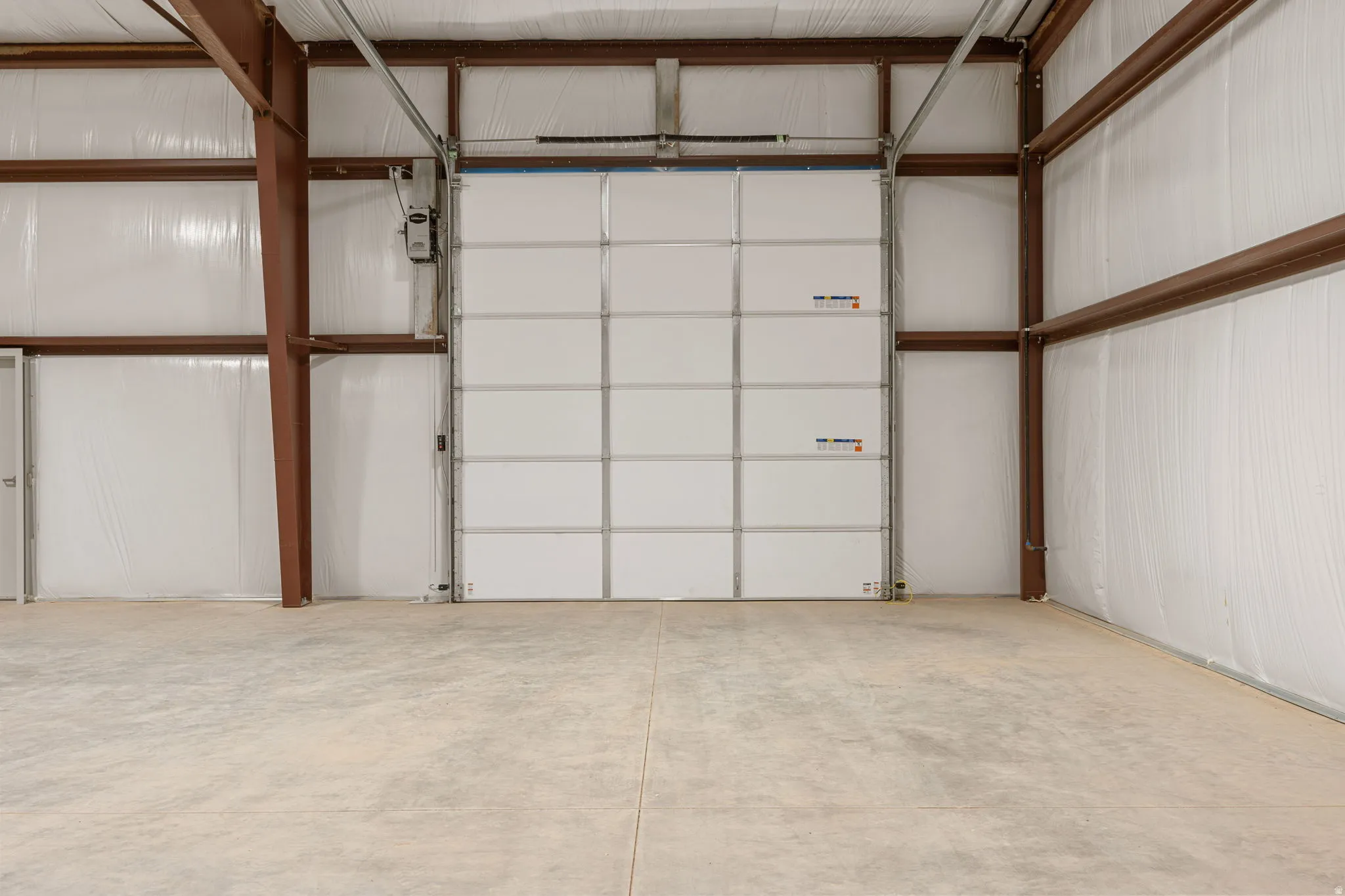 Garage featuring metal wall