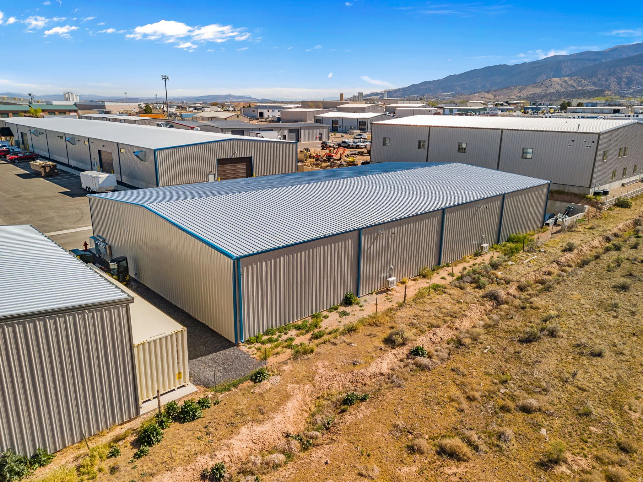 Drone / aerial view of mountains and industrial structures