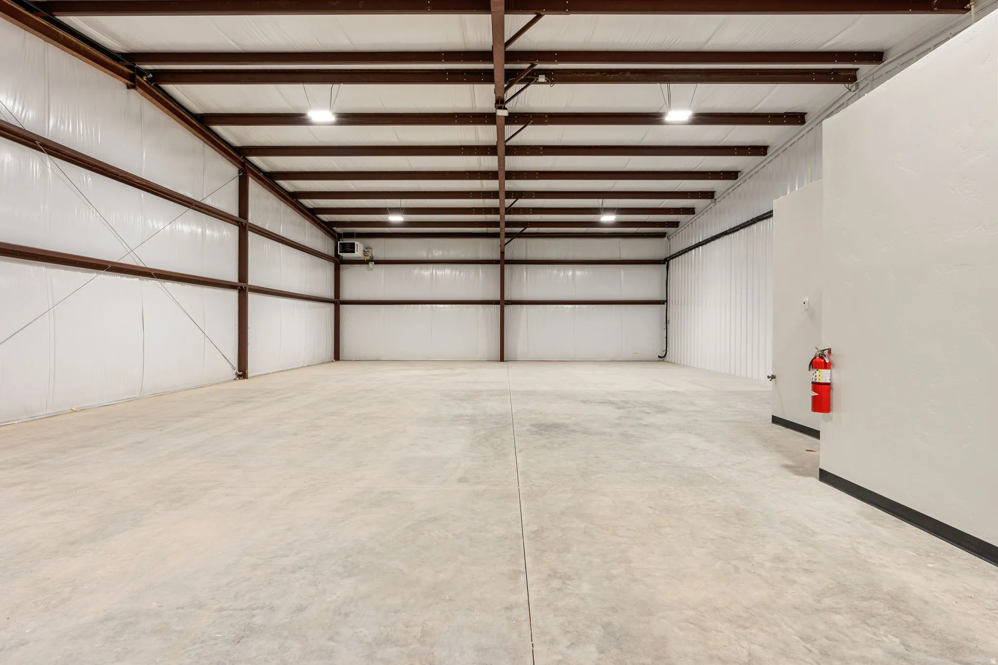 Garage featuring metal wall