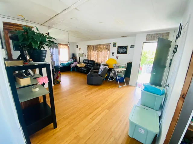 Living room with light wood-style flooring