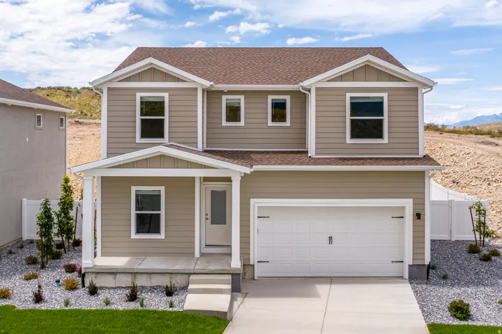 View of front of home featuring a shingled roof, board and batten siding, a garage, driveway, and a mountain view