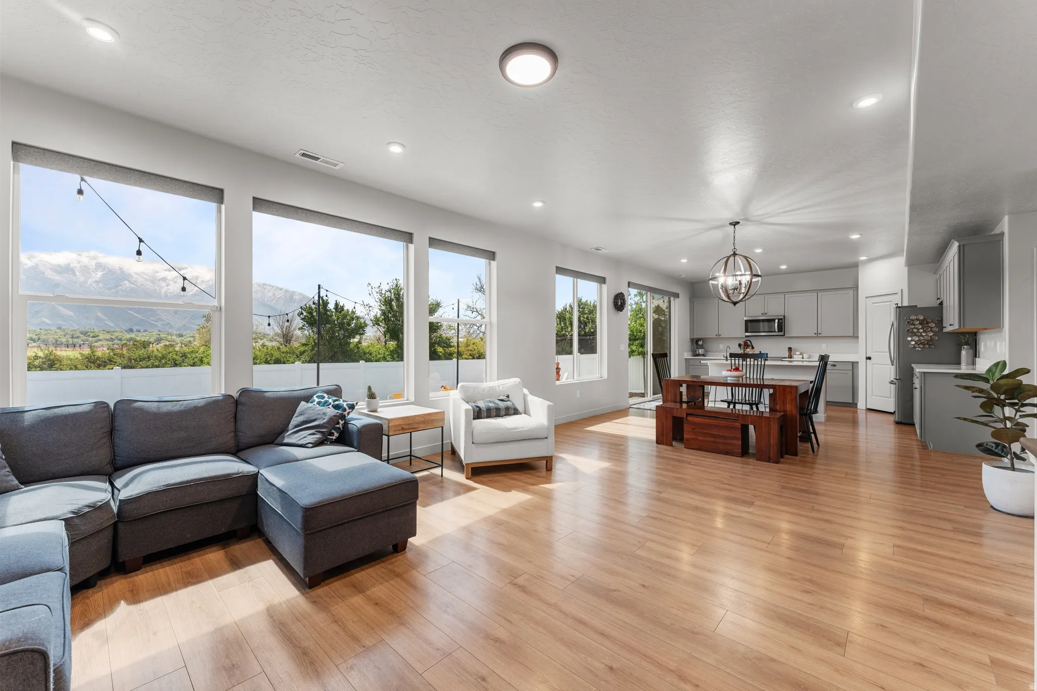 Living room with a chandelier and light wood finished floors