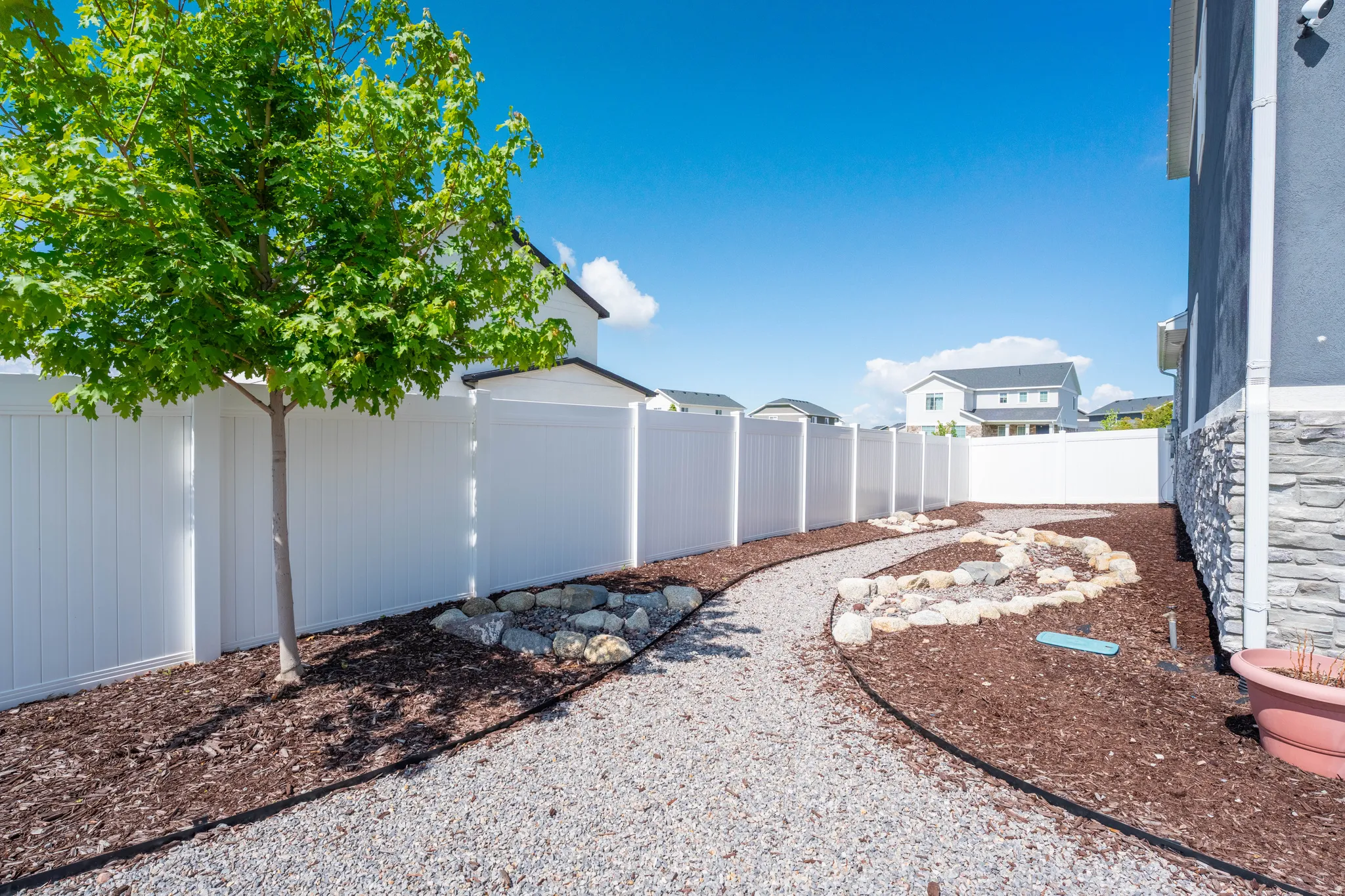 View of fenced backyard