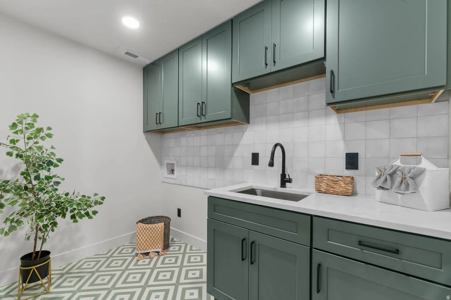 Laundry room featuring cabinet space, hookup for a washing machine, and recessed lighting