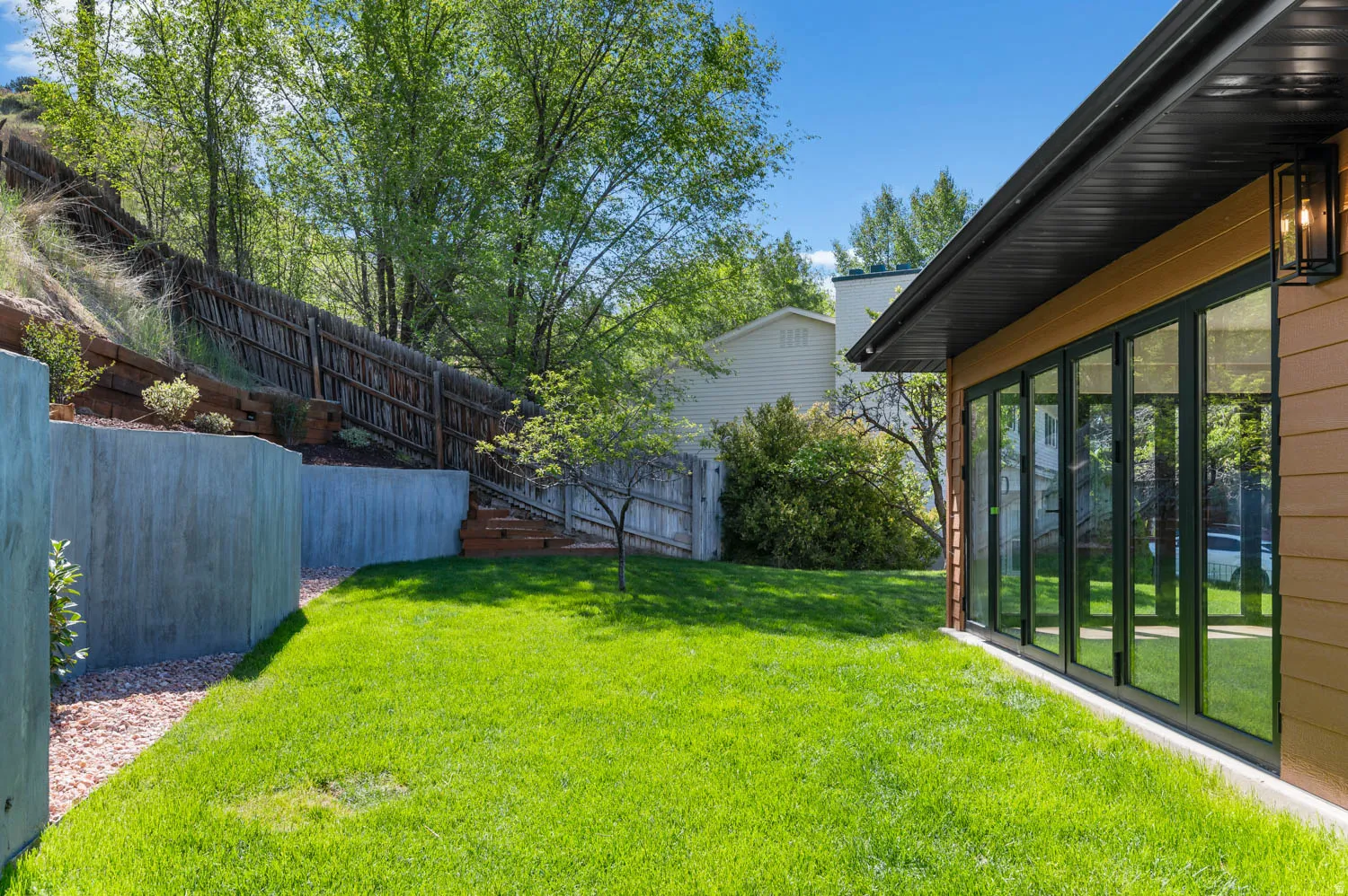 View of fenced backyard