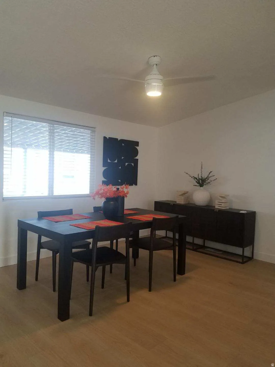 Dining space featuring light wood-style flooring and ceiling fan