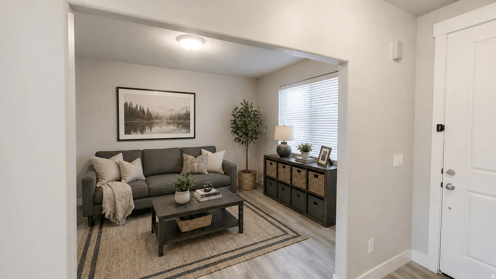Virtually Staged Living area featuring light wood-style floors and baseboards