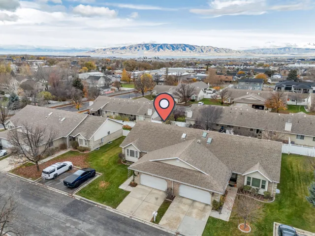 Aerial perspective of suburban area featuring a mountain backdrop