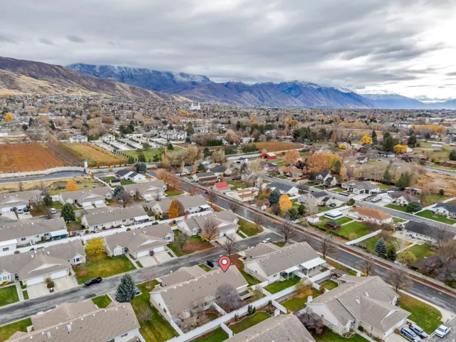 Aerial perspective of suburban area featuring a mountain backdrop