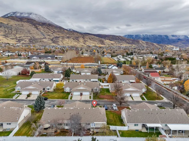 Aerial view of residential area featuring a mountain backdrop